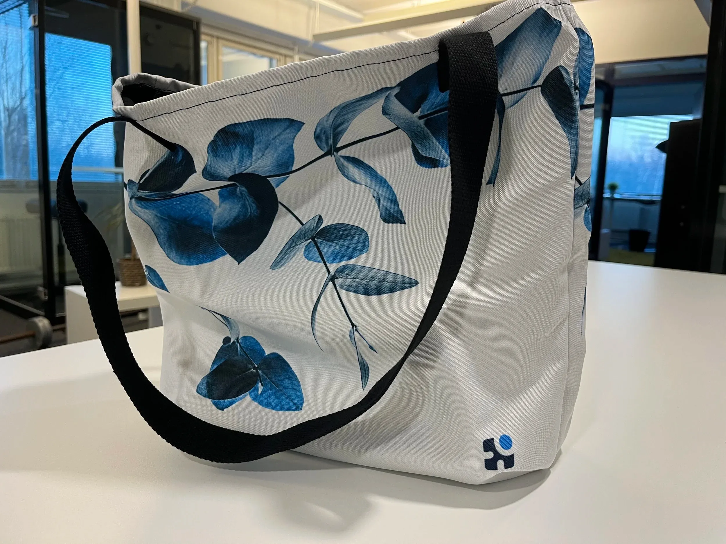 Brand collateral showing the identity applied to physical materials